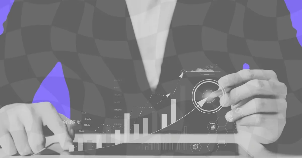 An analyst examining development data charts on a screen